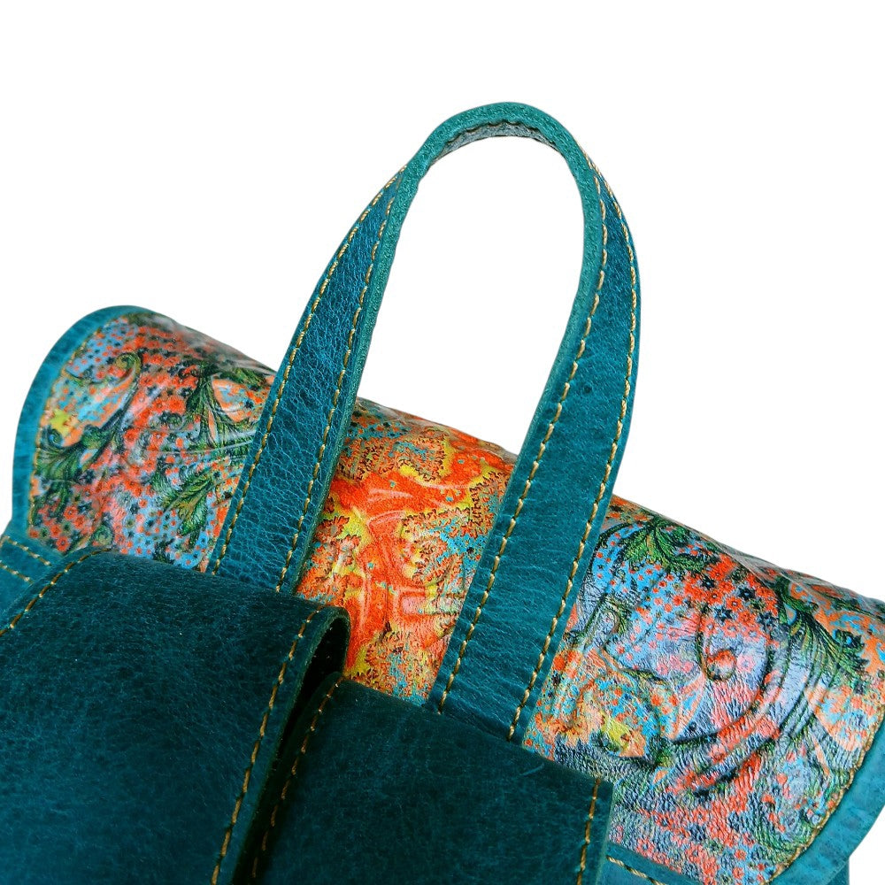 Antique gold brass buckle detail on teal leather women's backpack — genuine leather bag online Pakistan