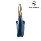 Navy blue leather tote bag with magnetic closure